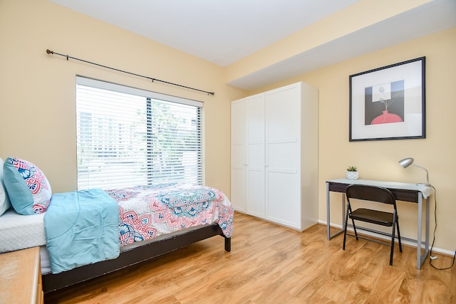 bedroom with light hardwood / wood-style floors