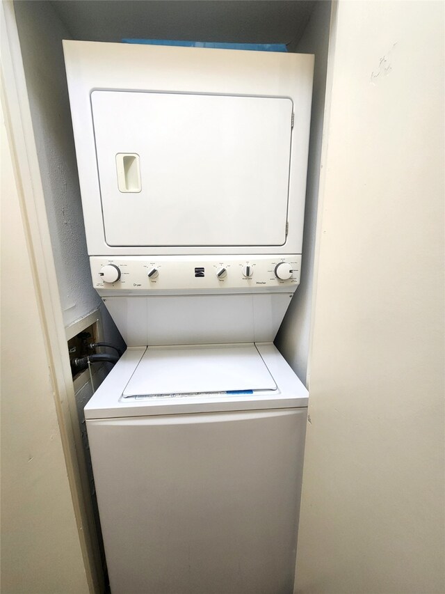 washroom with stacked washer / dryer