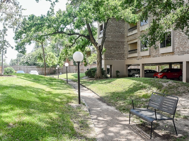 view of home's community with a yard