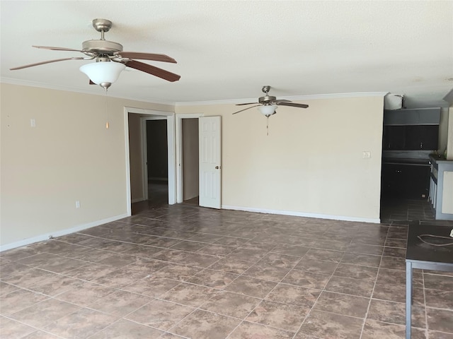 empty room featuring ceiling fan, a textured ceiling, baseboards, and crown molding