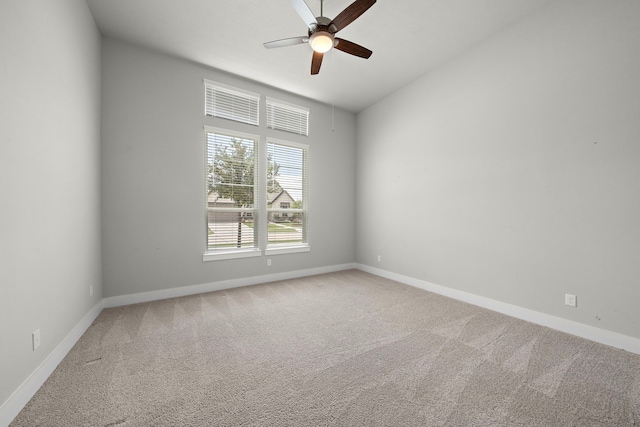 unfurnished room with carpet floors and ceiling fan