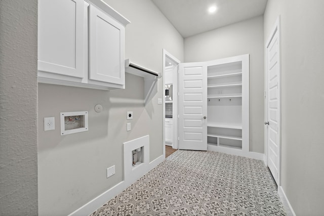 laundry room with gas dryer hookup, cabinets, washer hookup, and hookup for an electric dryer