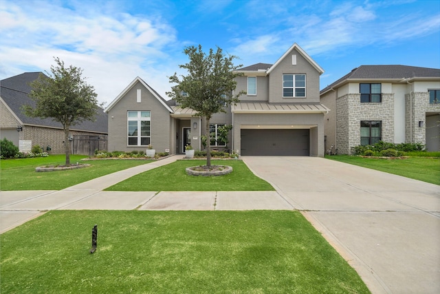 view of front of home featuring a garage and a front yard