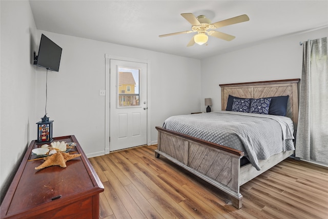 bedroom with ceiling fan and light hardwood / wood-style floors