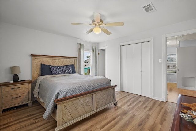 bedroom with ceiling fan and light hardwood / wood-style floors