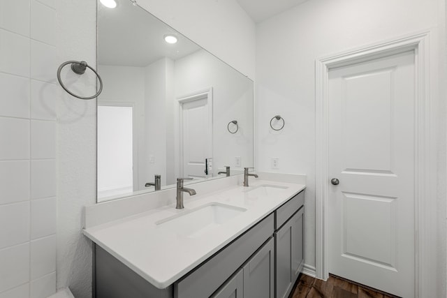 bathroom featuring vanity and hardwood / wood-style flooring