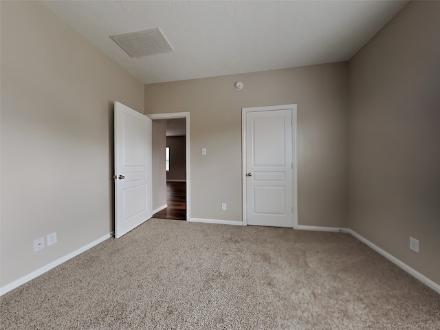 unfurnished bedroom with carpet