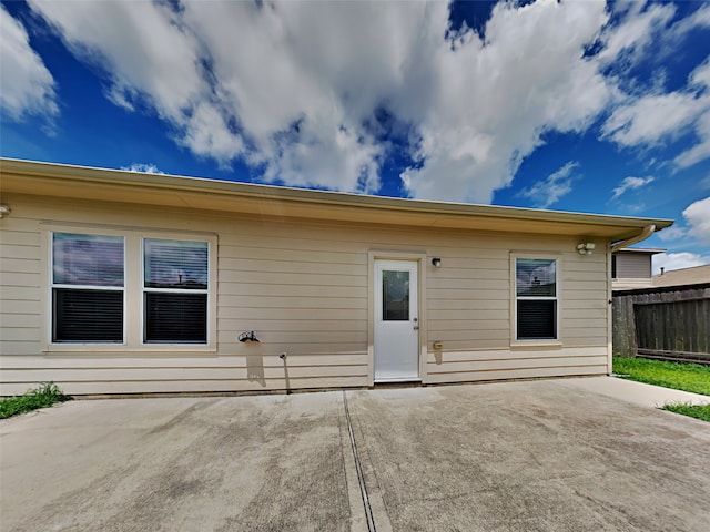 back of property with a patio area