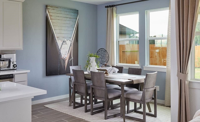 dining area with hardwood / wood-style floors