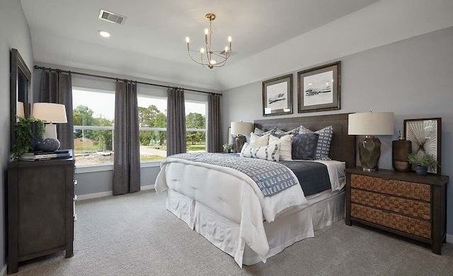 carpeted bedroom featuring a notable chandelier