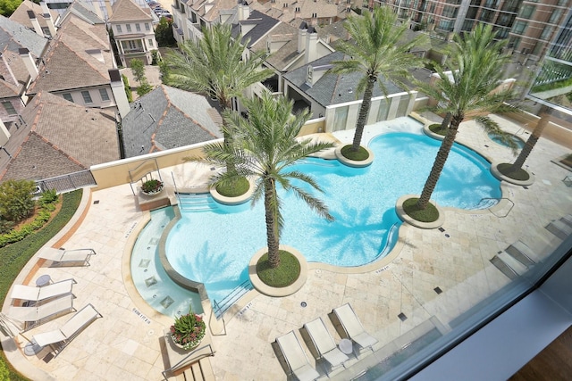 pool featuring a patio and a fenced backyard