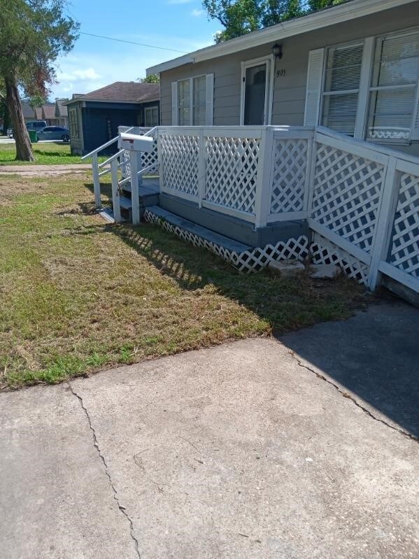 view of property exterior with a yard