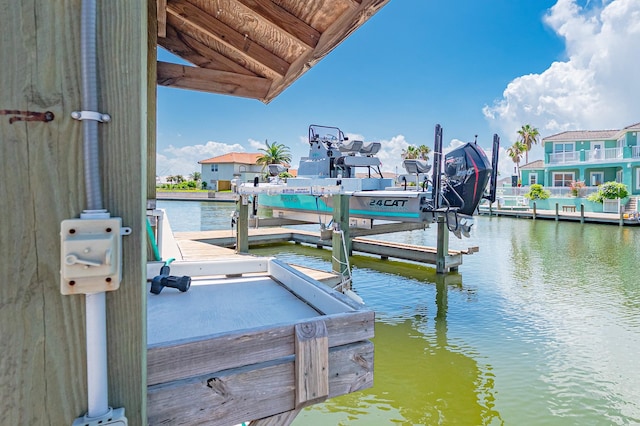 view of dock featuring a water view and boat lift