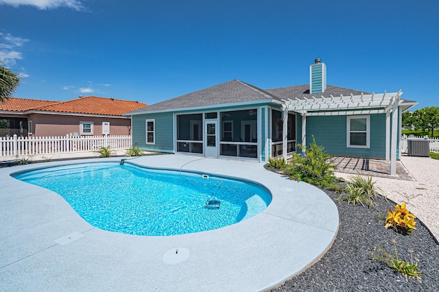 view of pool with a fenced in pool, a sunroom, a patio area, fence, and a pergola