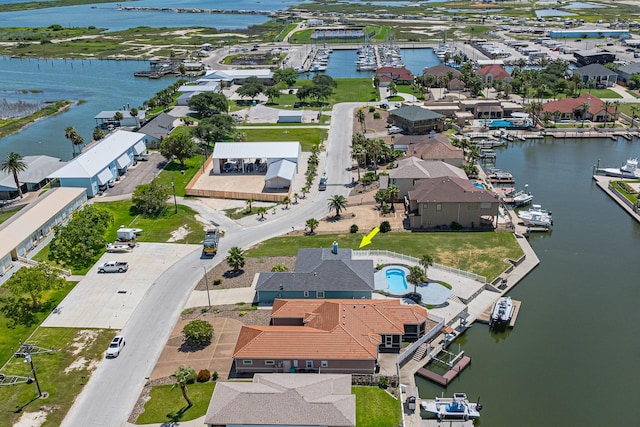 drone / aerial view featuring a water view and a residential view