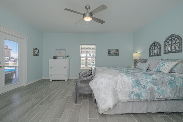 bedroom with ceiling fan and light wood-type flooring