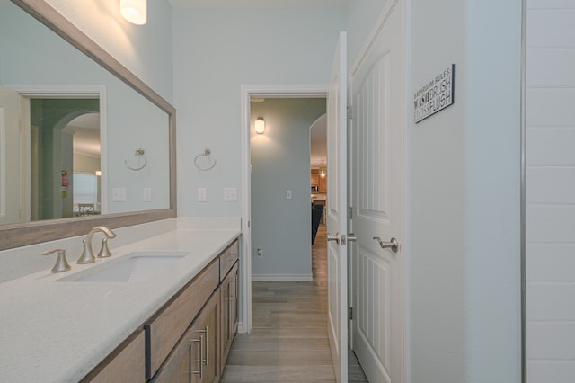 bathroom with wood-type flooring and vanity