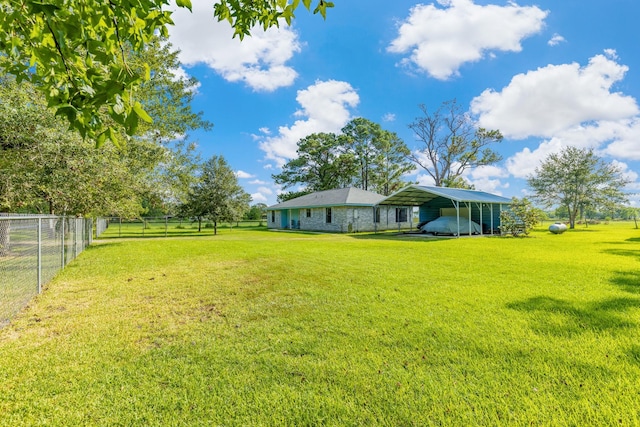 view of yard featuring a carport