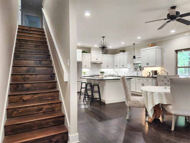 interior space with dark wood-style floors, stairway, a ceiling fan, and recessed lighting