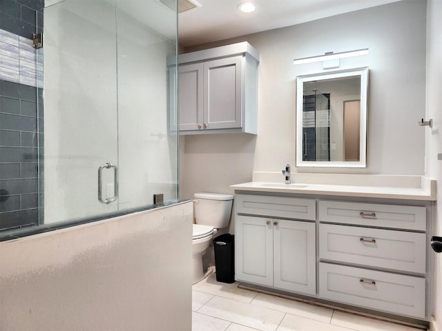 full bathroom featuring visible vents, toilet, tile patterned flooring, an enclosed shower, and vanity