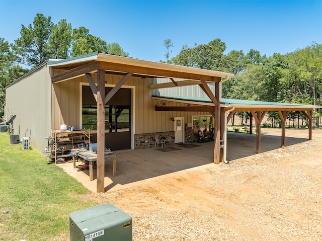 exterior space featuring a yard and a carport