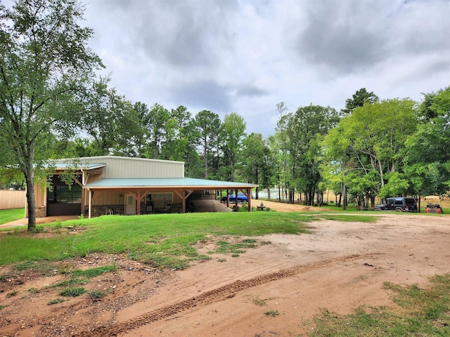 view of home's community with an exterior structure and an outdoor structure