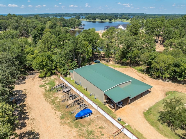 aerial view with a forest view and a water view