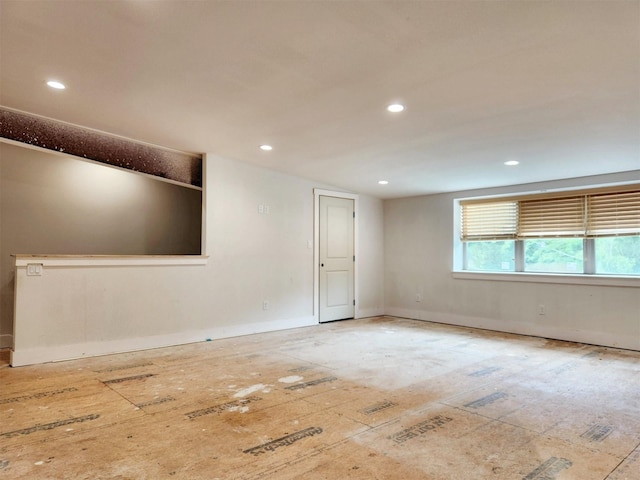 unfurnished room featuring recessed lighting