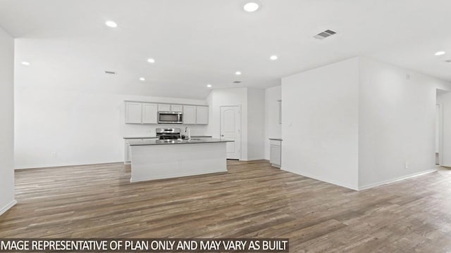 unfurnished living room with hardwood / wood-style floors