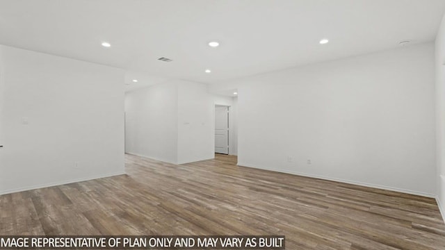 empty room featuring wood-type flooring