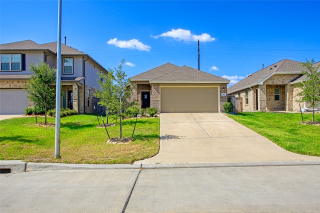 view of front of house with a garage and a front yard