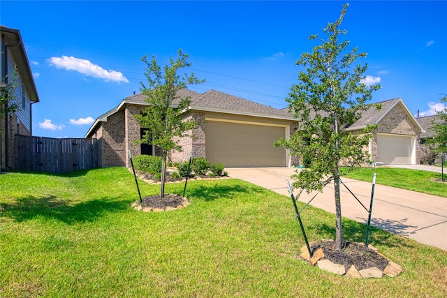 view of front facade featuring a front yard and a garage