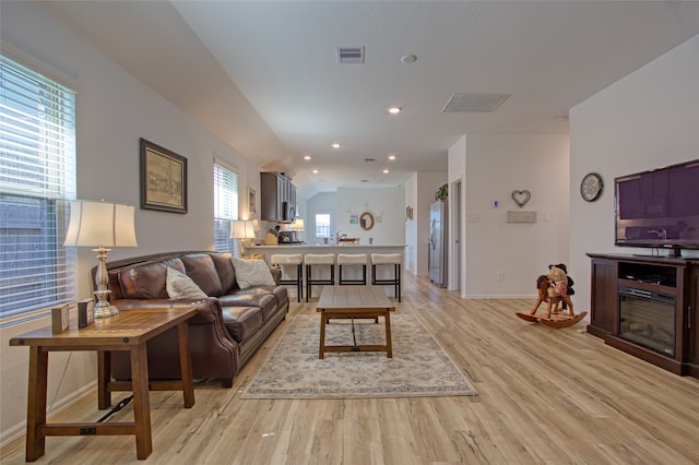 living room with light hardwood / wood-style floors