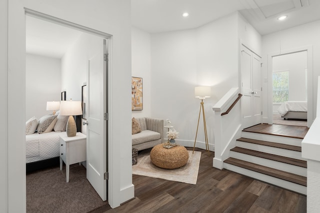 living area with baseboards, stairway, wood finished floors, and recessed lighting