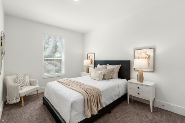 carpeted bedroom featuring baseboards