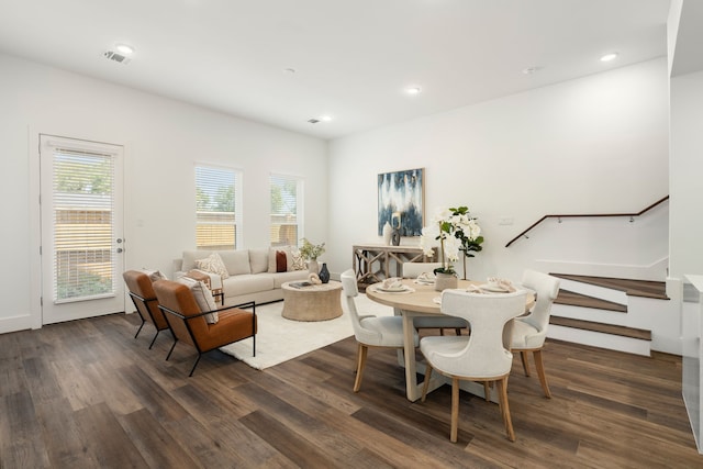 dining area with stairs, visible vents, dark wood-style flooring, and recessed lighting