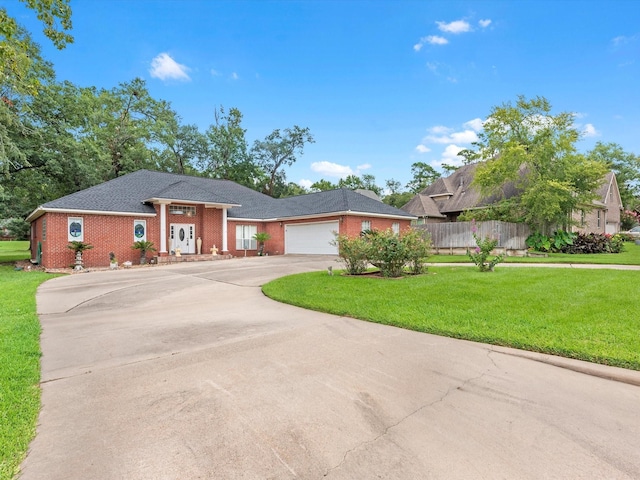 view of front facade with a garage and a front lawn