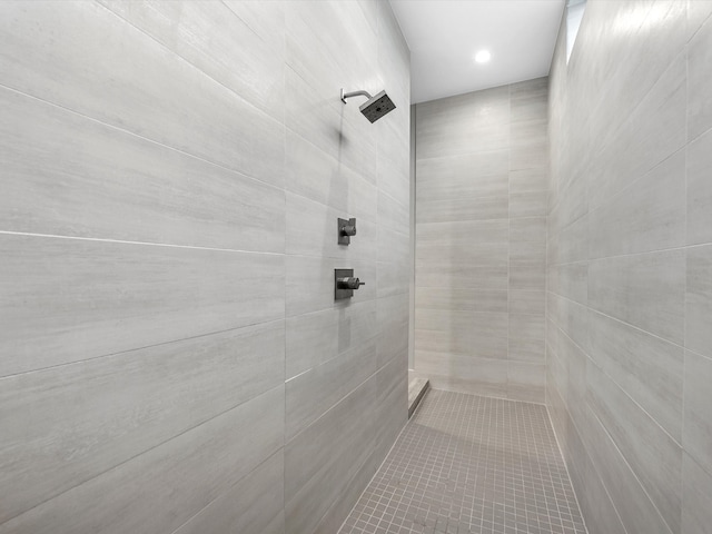 bathroom with a tile shower