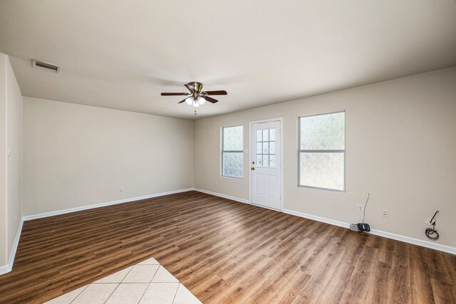 empty room featuring ceiling fan and wood-type flooring