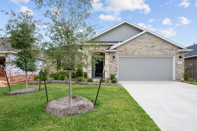 view of front of property with a garage and a front yard