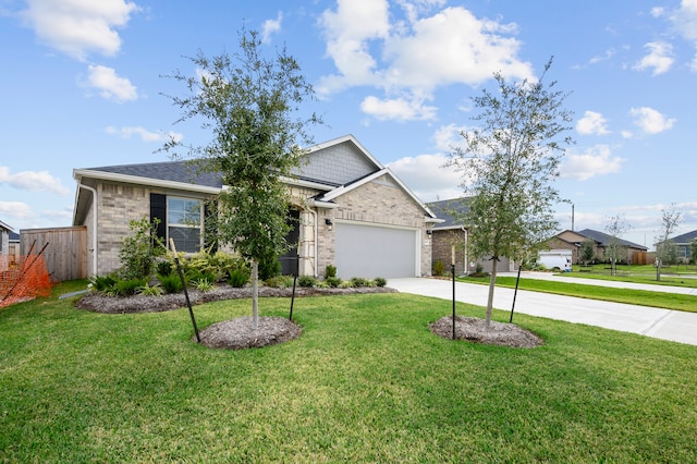 ranch-style home featuring a front yard and a garage