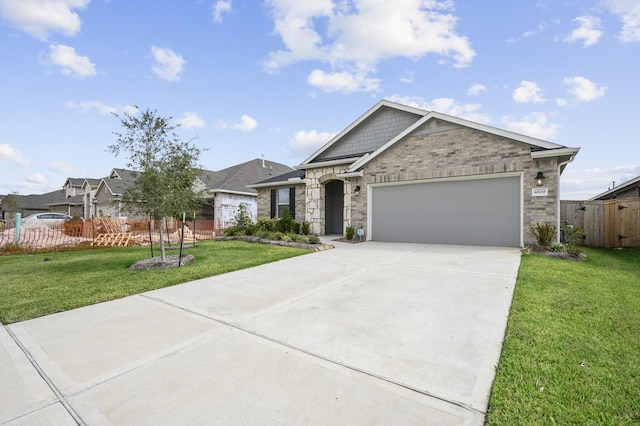 view of front of home with a garage and a front yard