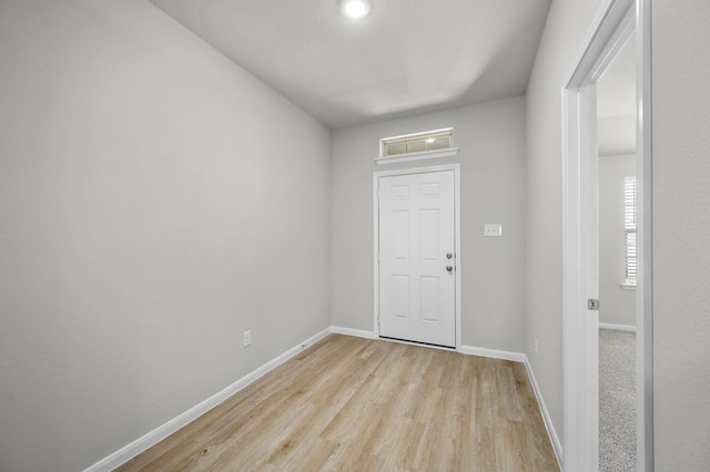 foyer entrance with light wood-type flooring