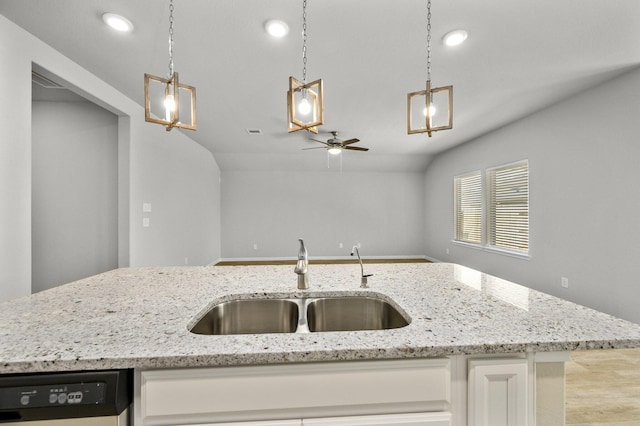 kitchen with white cabinetry, black dishwasher, sink, and pendant lighting