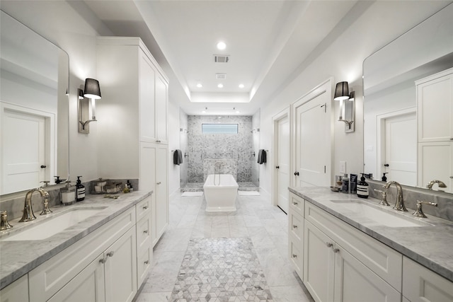 bathroom featuring plus walk in shower and vanity