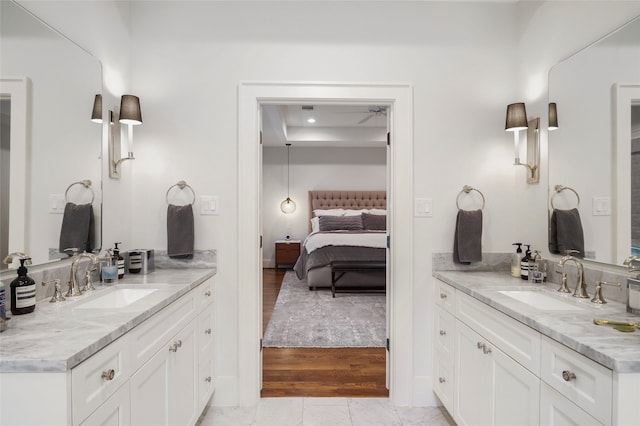 bathroom featuring vanity and hardwood / wood-style flooring