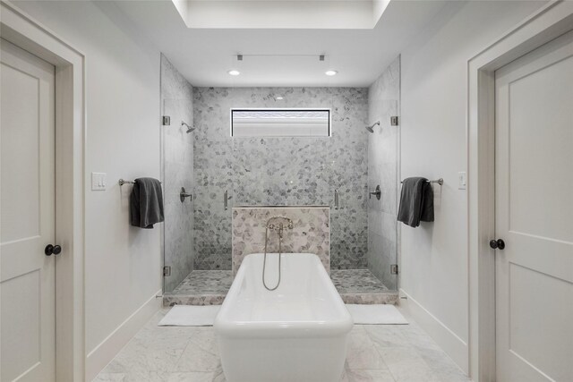 bathroom with separate shower and tub