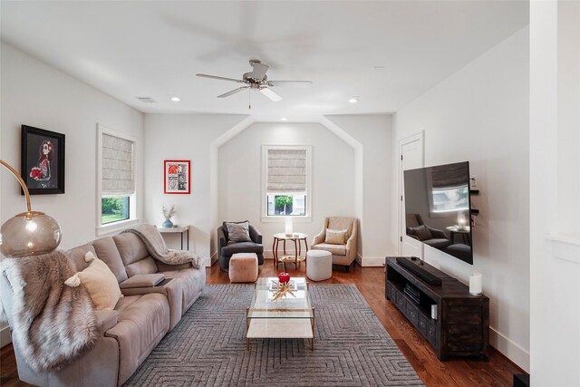 living room featuring dark hardwood / wood-style floors and ceiling fan