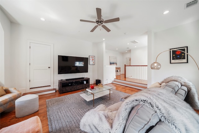 living room with hardwood / wood-style floors and ceiling fan