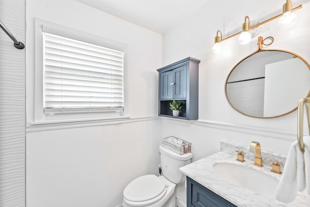 bathroom with toilet and vanity